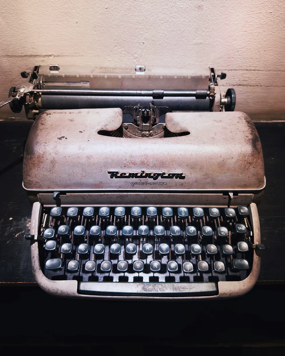 A vintage Remington typewriter in warm light